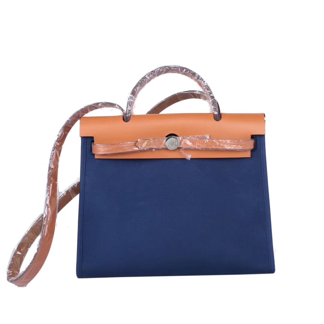 Hermès（爱马仕）Herbag 驼色盖头午夜蓝 帆布 银扣 31cm