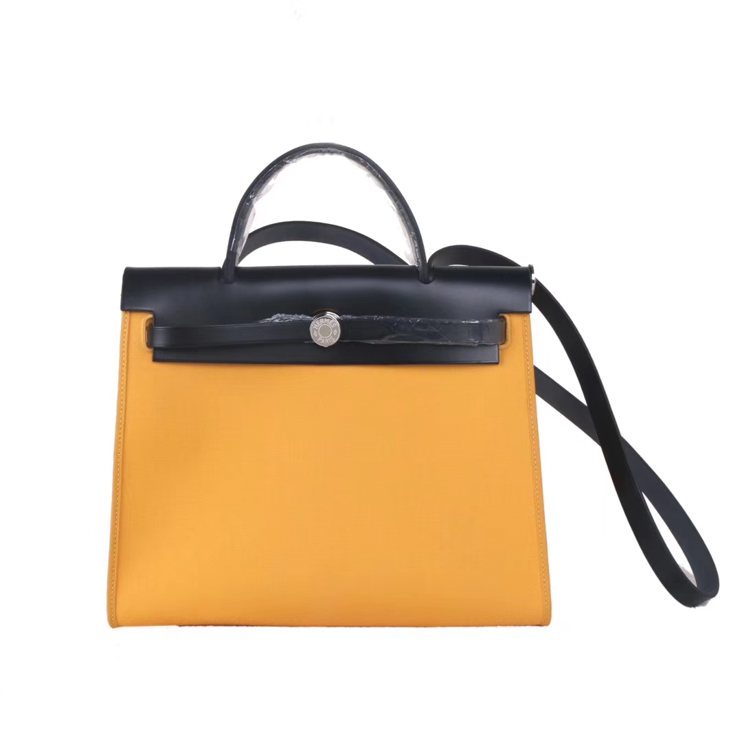 Hermès（爱马仕）Herbag 黑色盖头琥珀黄帆布 银扣 31cm